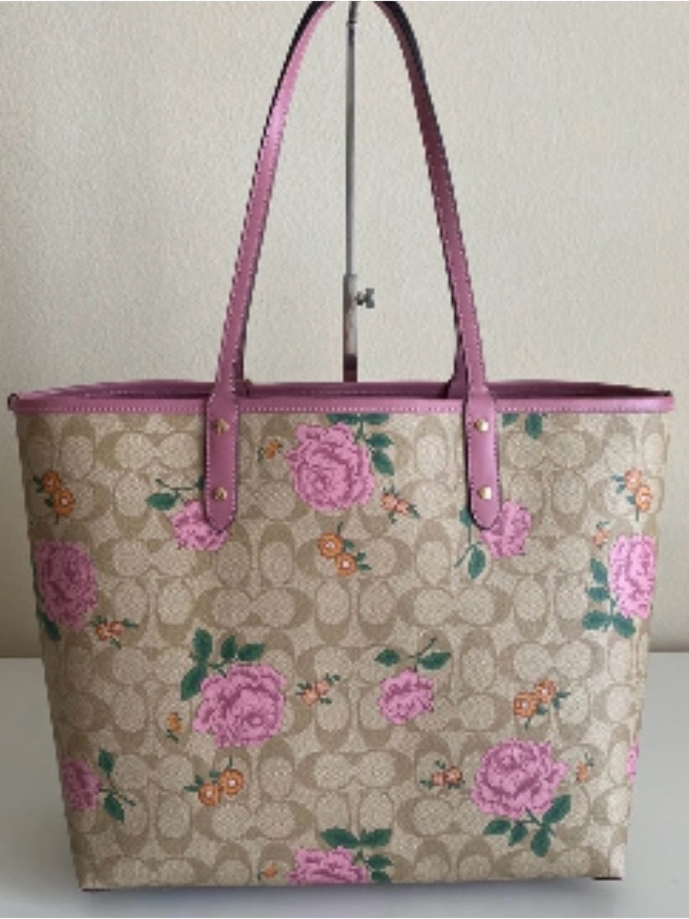 Coach Reversible City Tote featuring a signature storypatch design.
